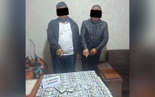 Андижонда маҳалла раиси ва ҳоким ёрдамчиси $3 минг пора билан ушланди