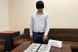 Тошкент вилоятида банк ходими $100 минг пора олган вақтида ушланди 